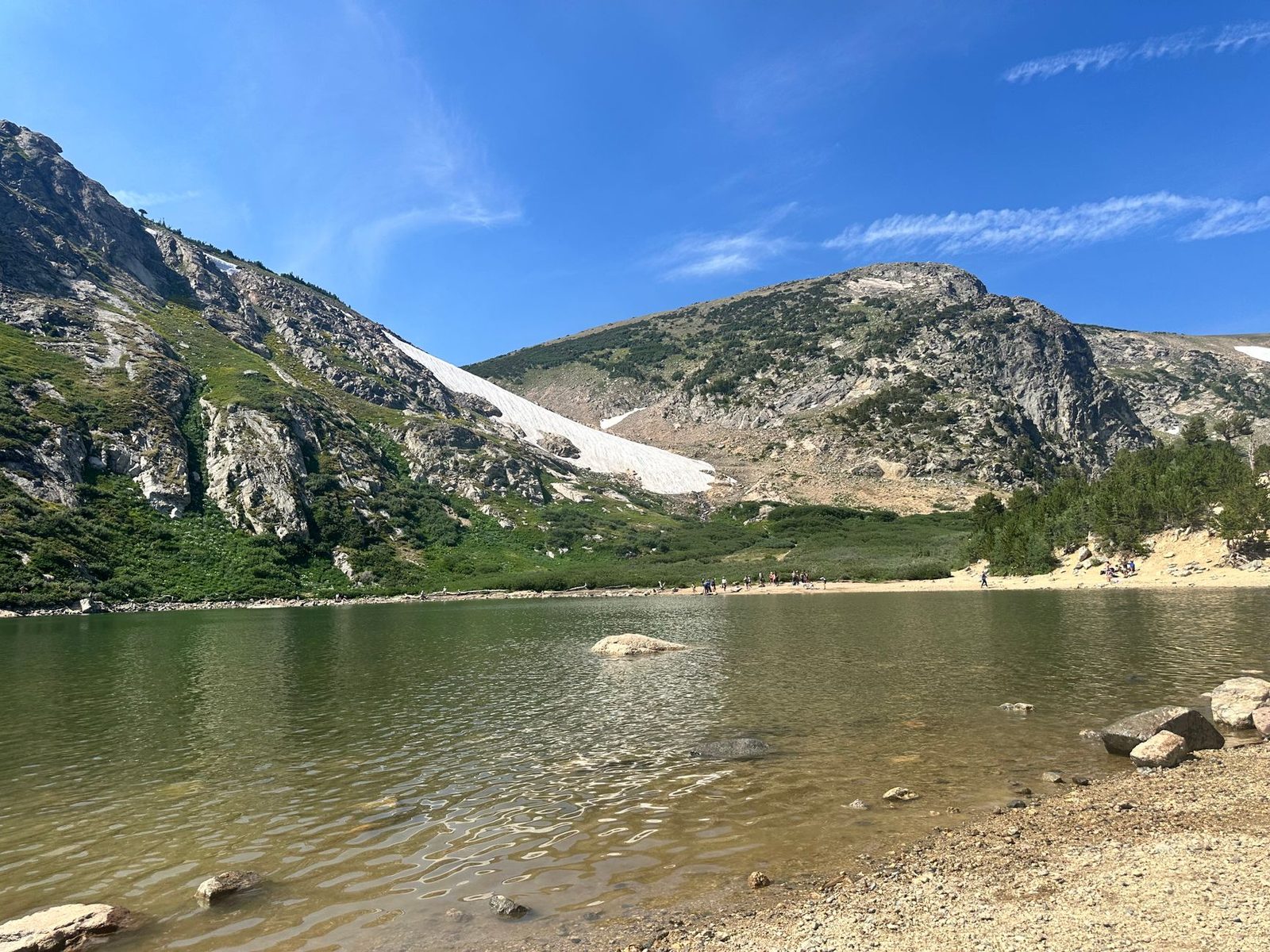 A Colorado alpine lake below a permanent snowfield